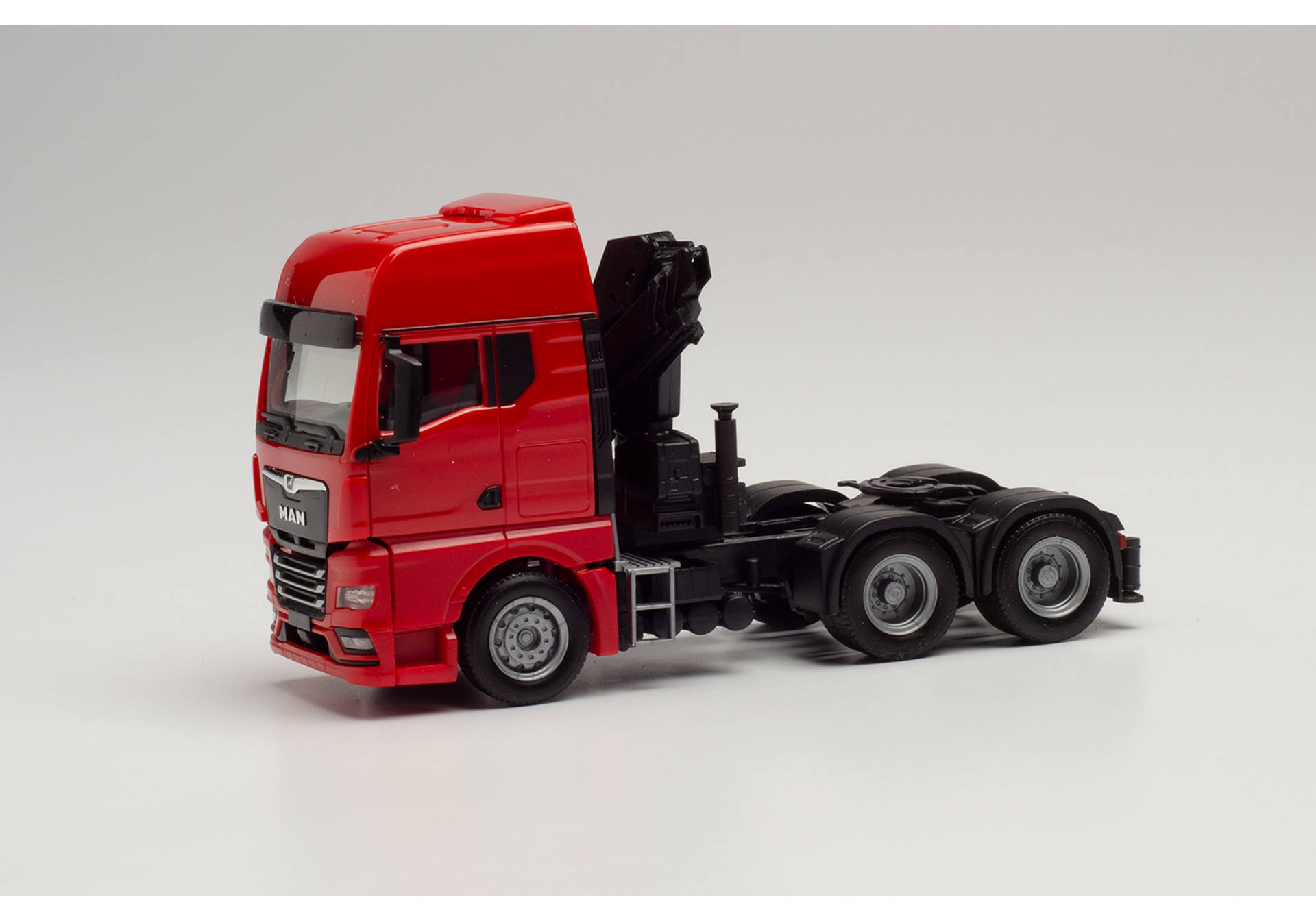 MAN TGX GX 6x4 tractor with crane, red