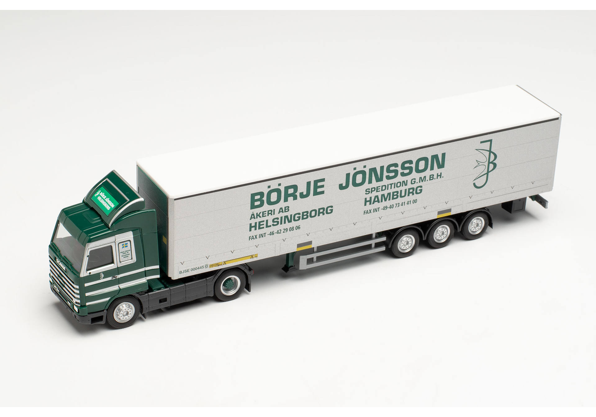 Scania 143 SL Gardinenplanen-Sattelzug mit Bordwänden „Börje Jönsson“