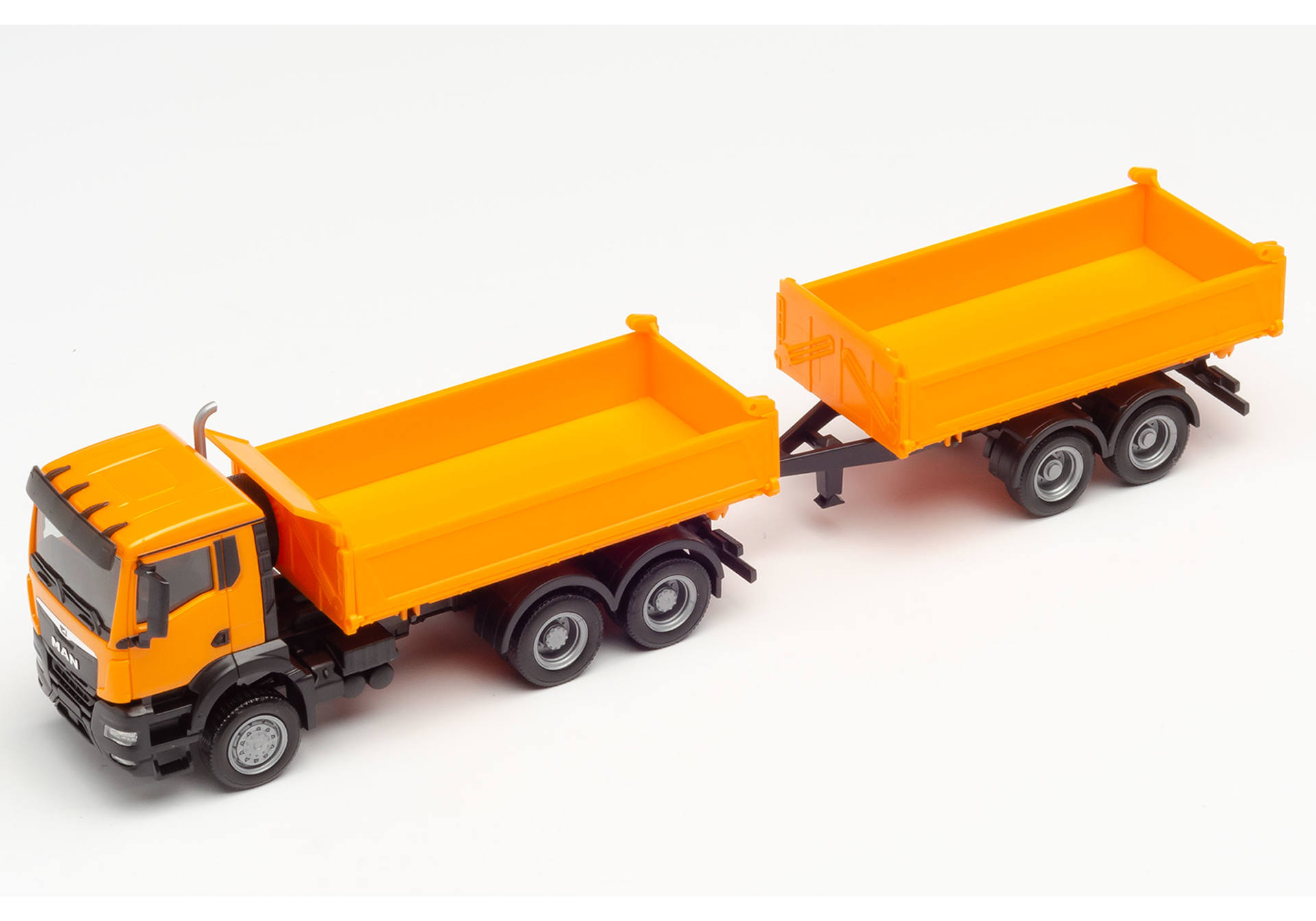 MAN TGX NN tandem construction tipper trailer truck, municipal orange