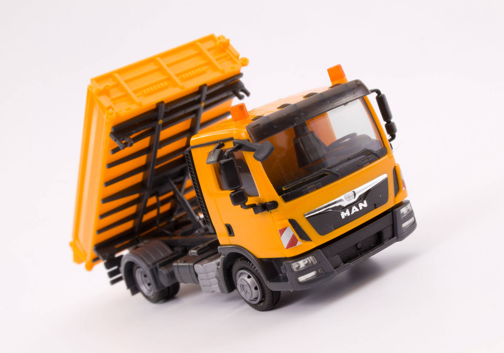 MAN TGL three way tipper, orange