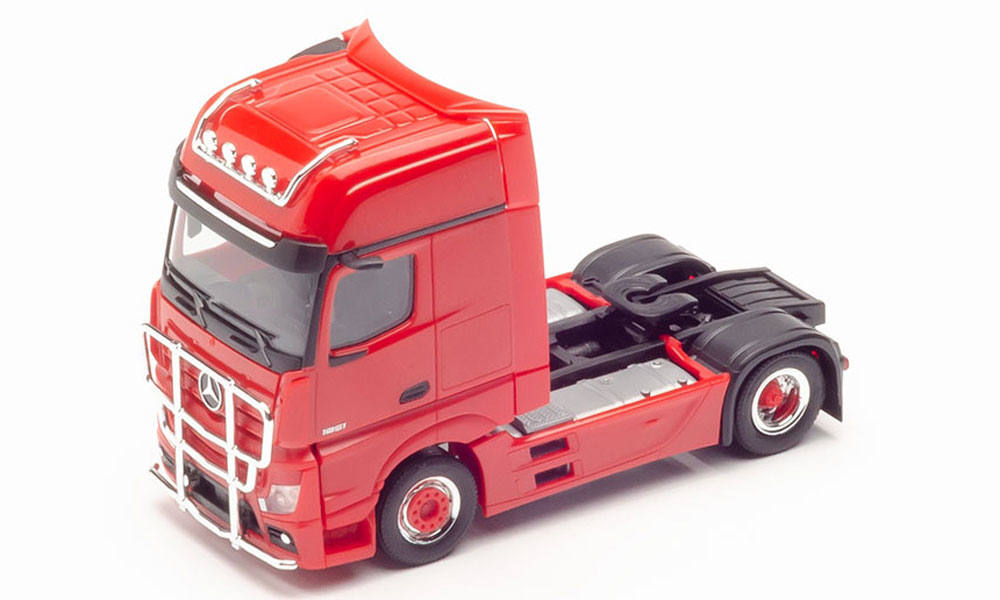 rigid tractor with impact protection and lamp bracket