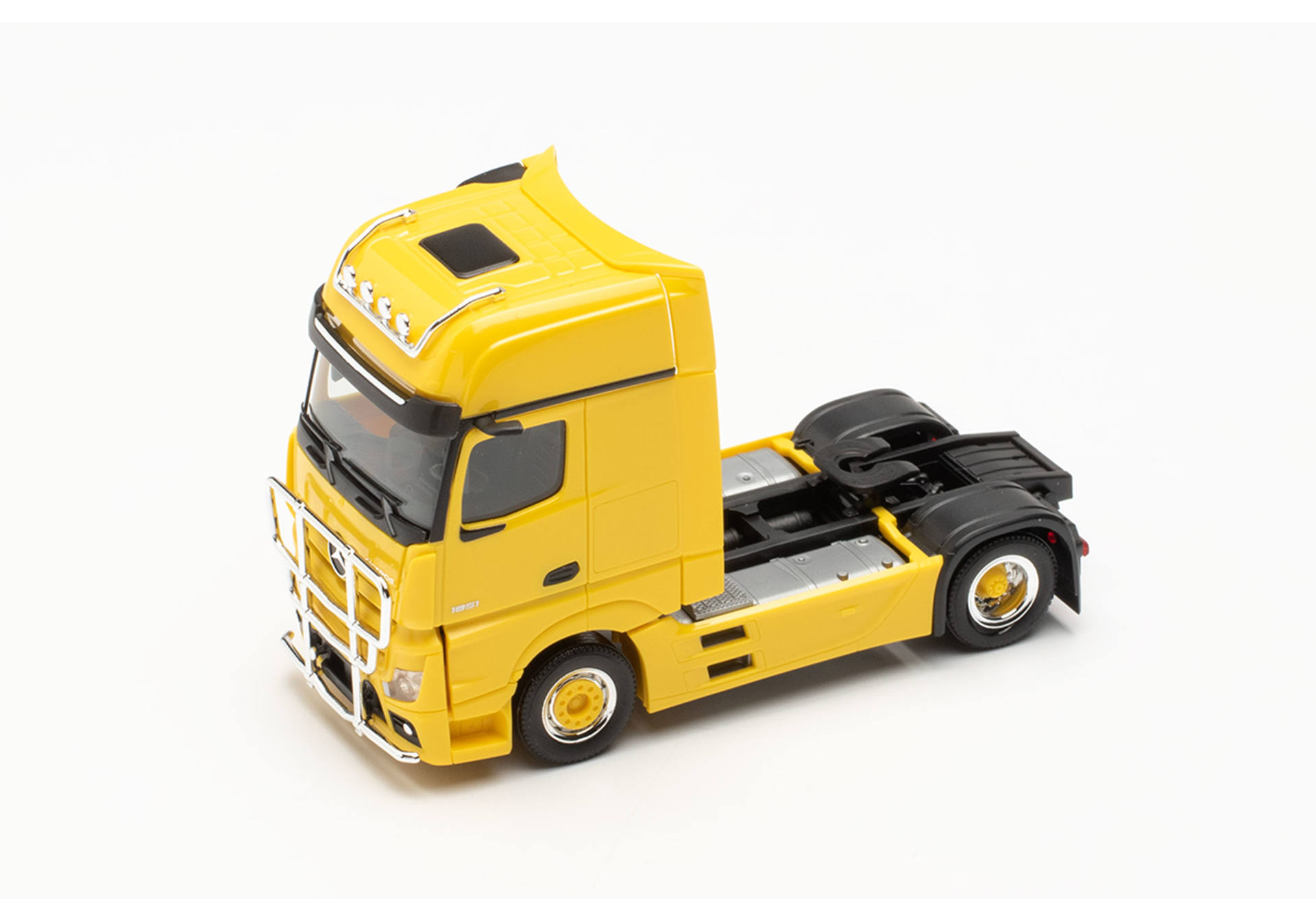 Mercedes-Benz Actros Gigaspace tractor with lamp bar and bull bar, traffic yellow