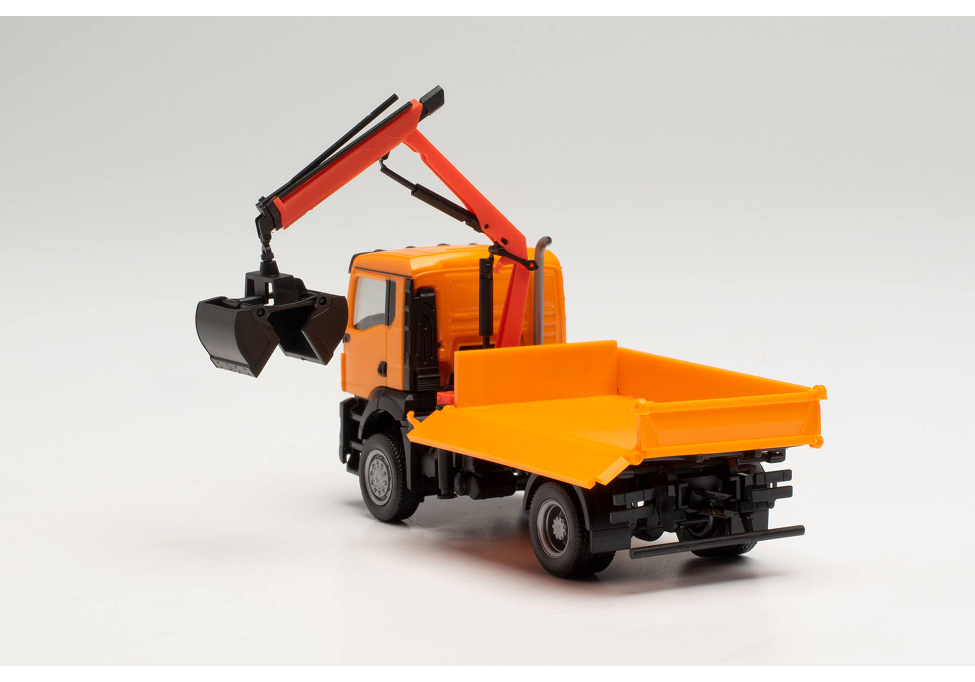 MAN TGS NN three way tipper with cramshell grab, municipal orange