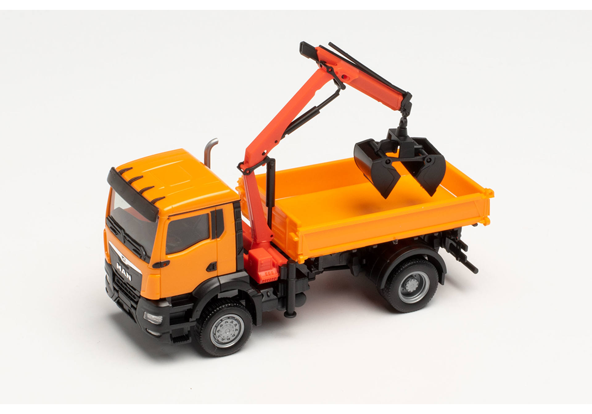 MAN TGS NN three way tipper with cramshell grab, municipal orange