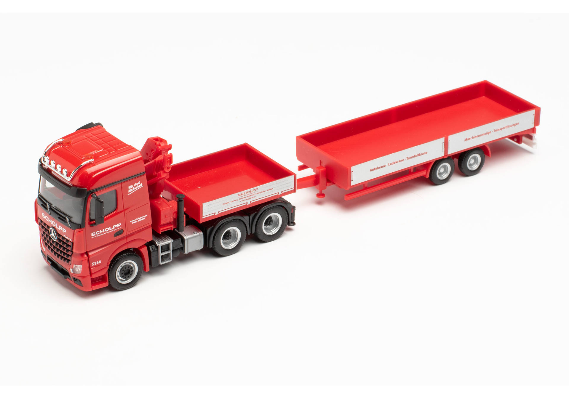 Mercedes-Benz Arocs tractor with loading crane, ballast flatbed, and low-body trailer Scholpp.