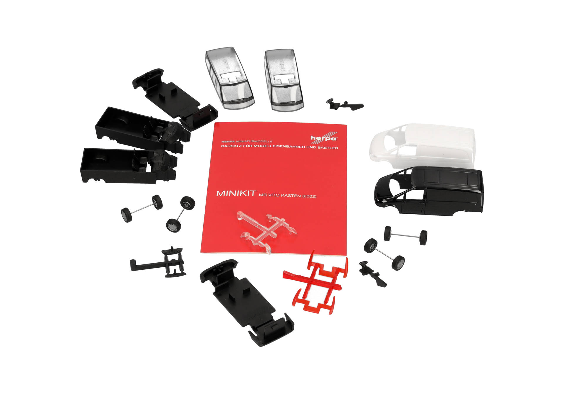Modellkit, Modelleisenbahn, Minikit, Teile, rote Anleitung, Modellbausatz, Minikit, Modelleisenbahn, Modelleisenbahnwagen, Montagebauteile
