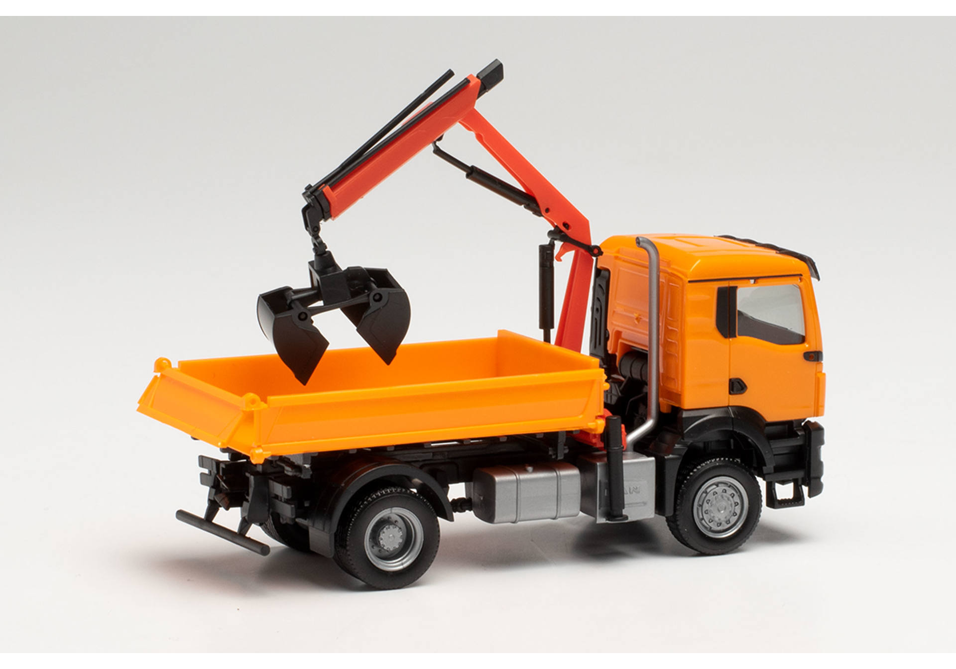 MAN TGS NN three way tipper with cramshell grab, municipal orange