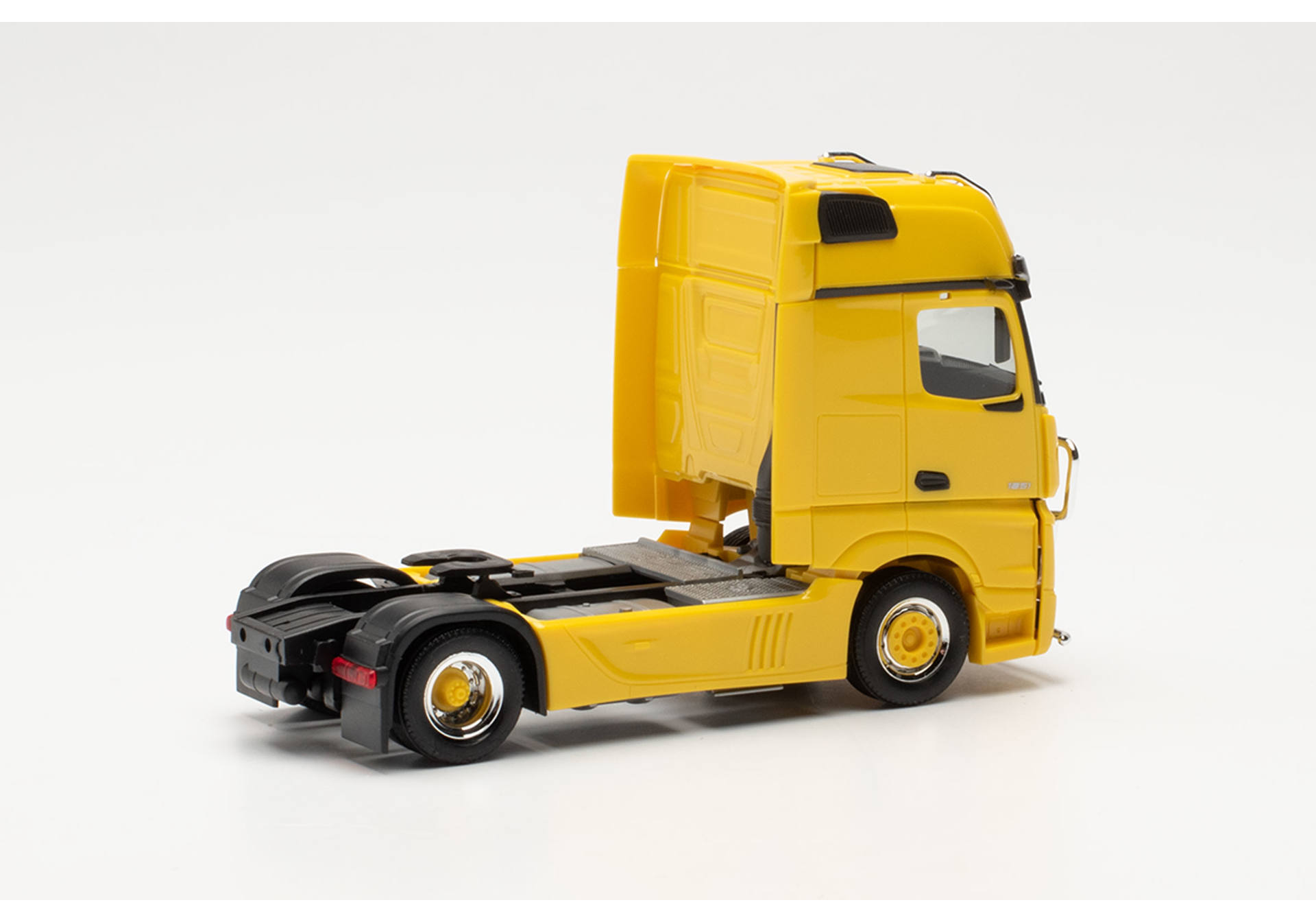 Mercedes-Benz Actros Gigaspace tractor with lamp bar and bull bar, traffic yellow