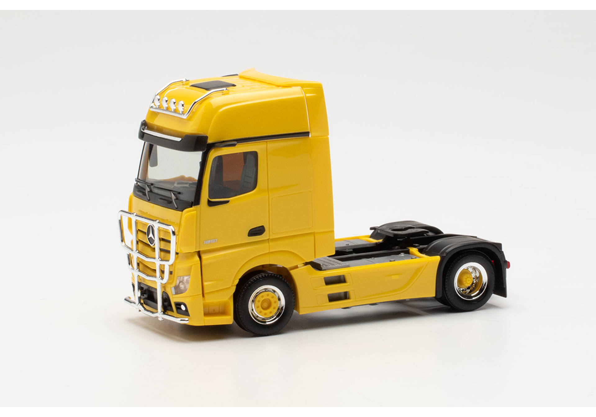 Mercedes-Benz Actros Gigaspace tractor with lamp bar and bull bar, traffic yellow