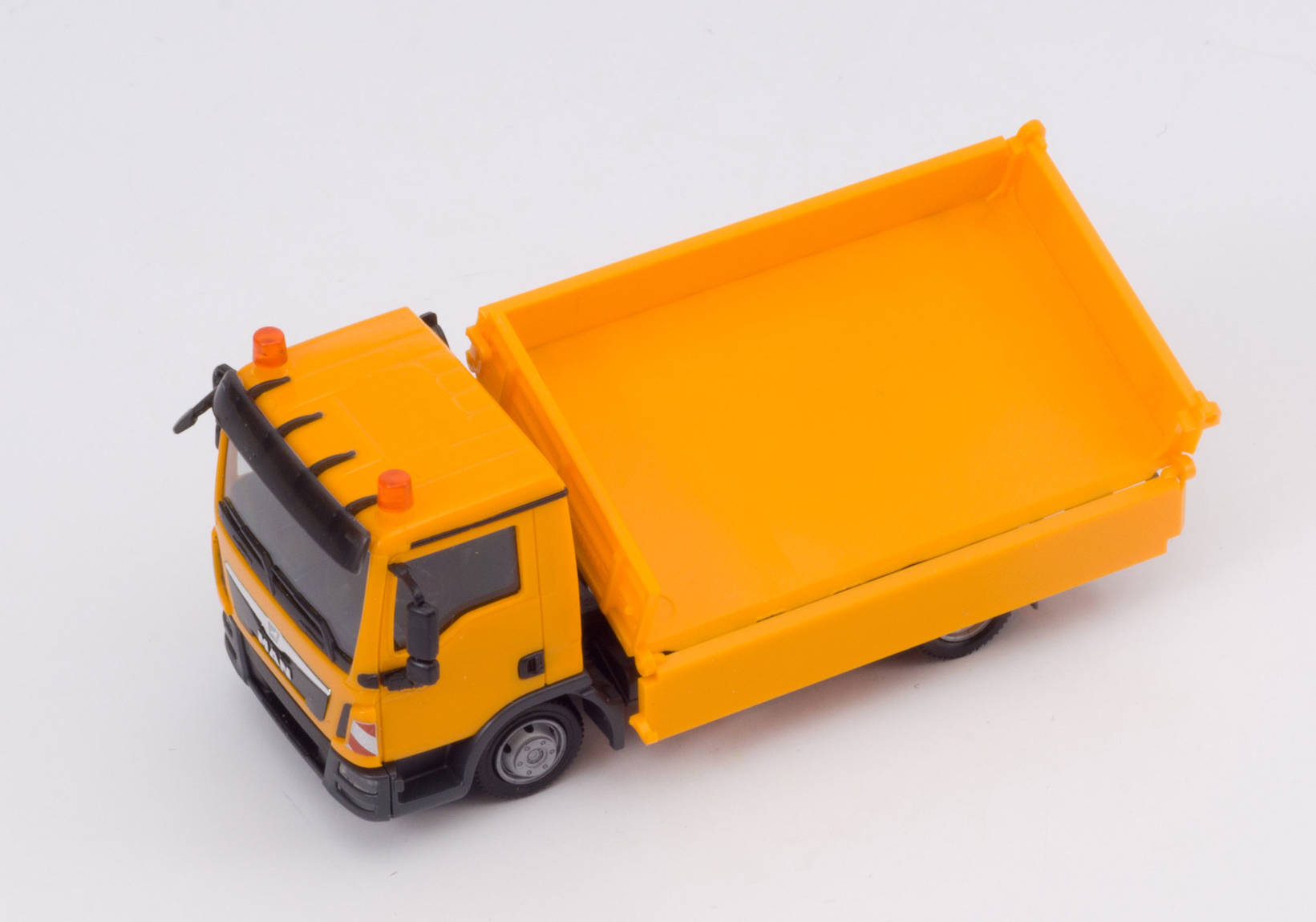 MAN TGL three way tipper, orange