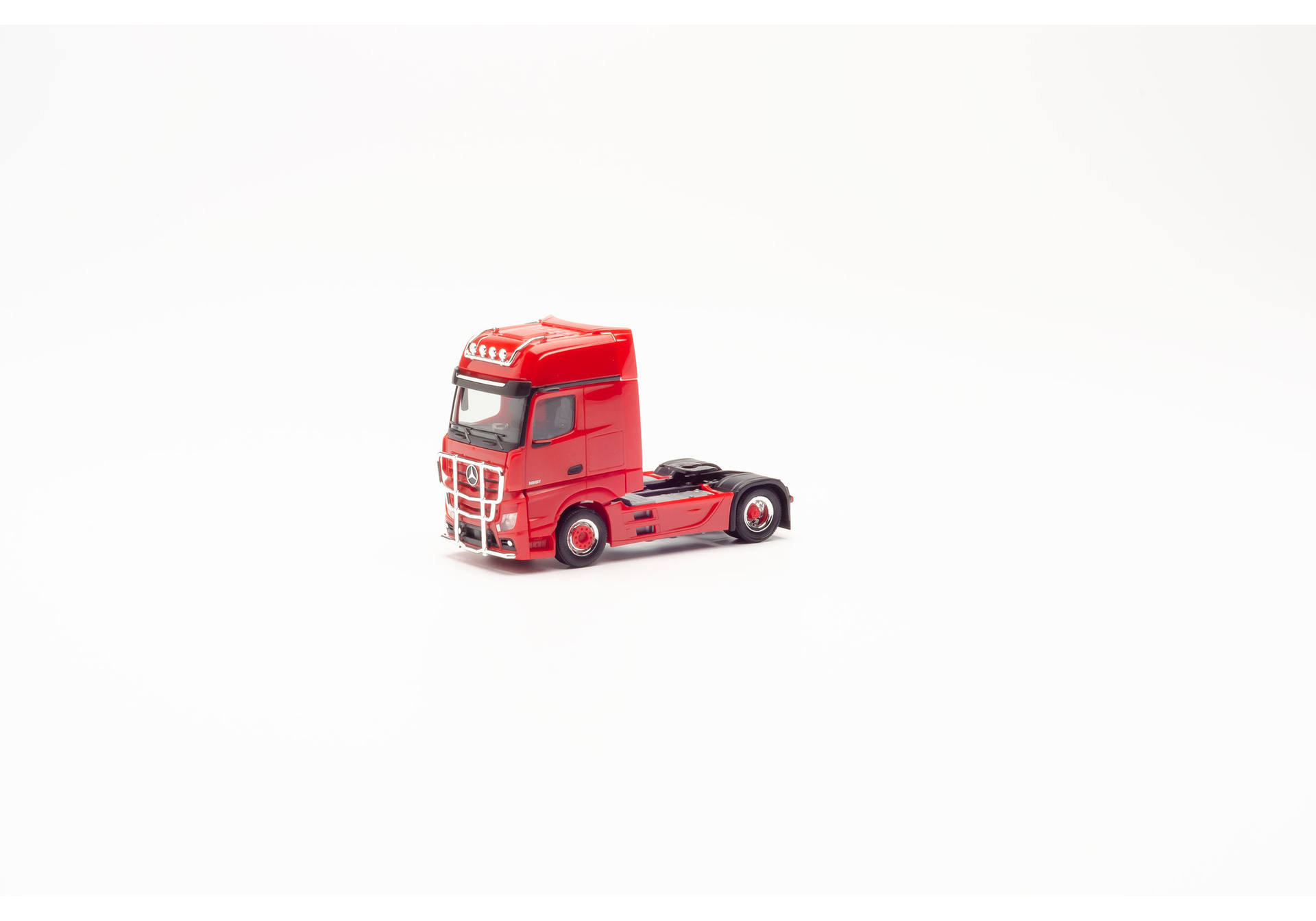 rigid tractor with impact protection and lamp bracket