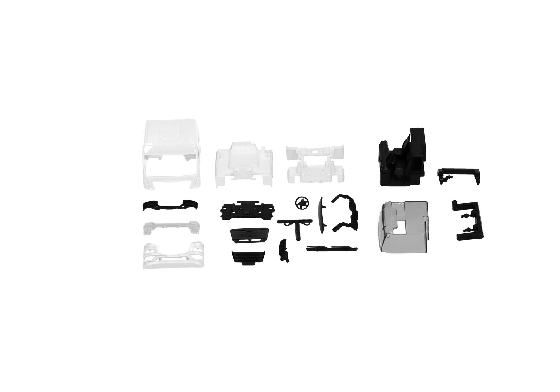 model kit, assembly parts, plastic pieces, white and black components, unassembled toy car