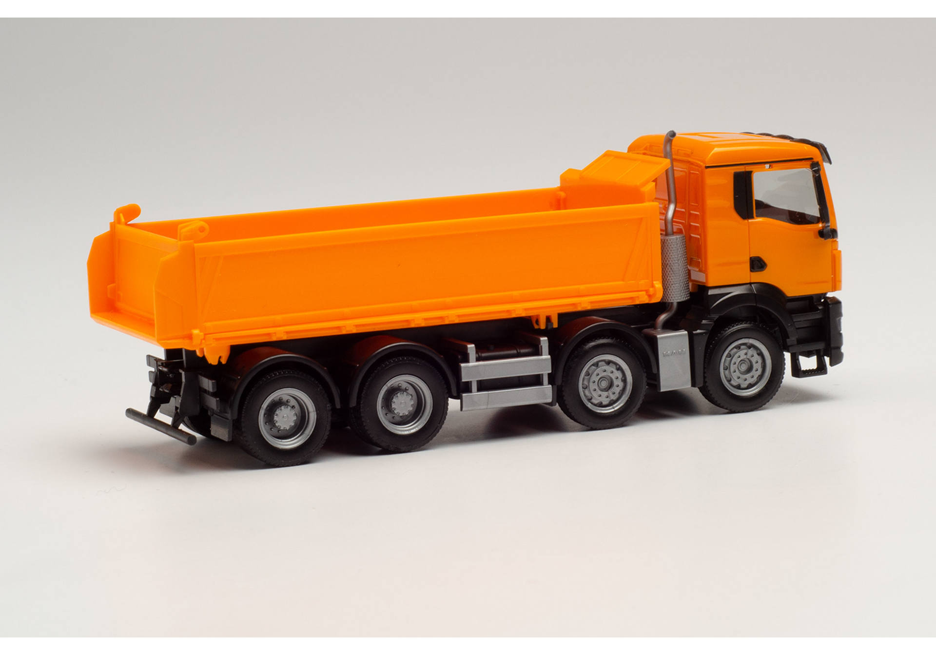 MAN TGS NN tipper truck, municipal orange