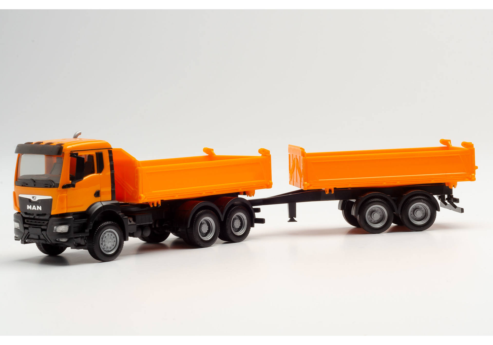 MAN TGX NN tandem construction tipper trailer truck, municipal orange