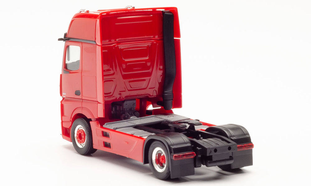 rigid tractor with impact protection and lamp bracket