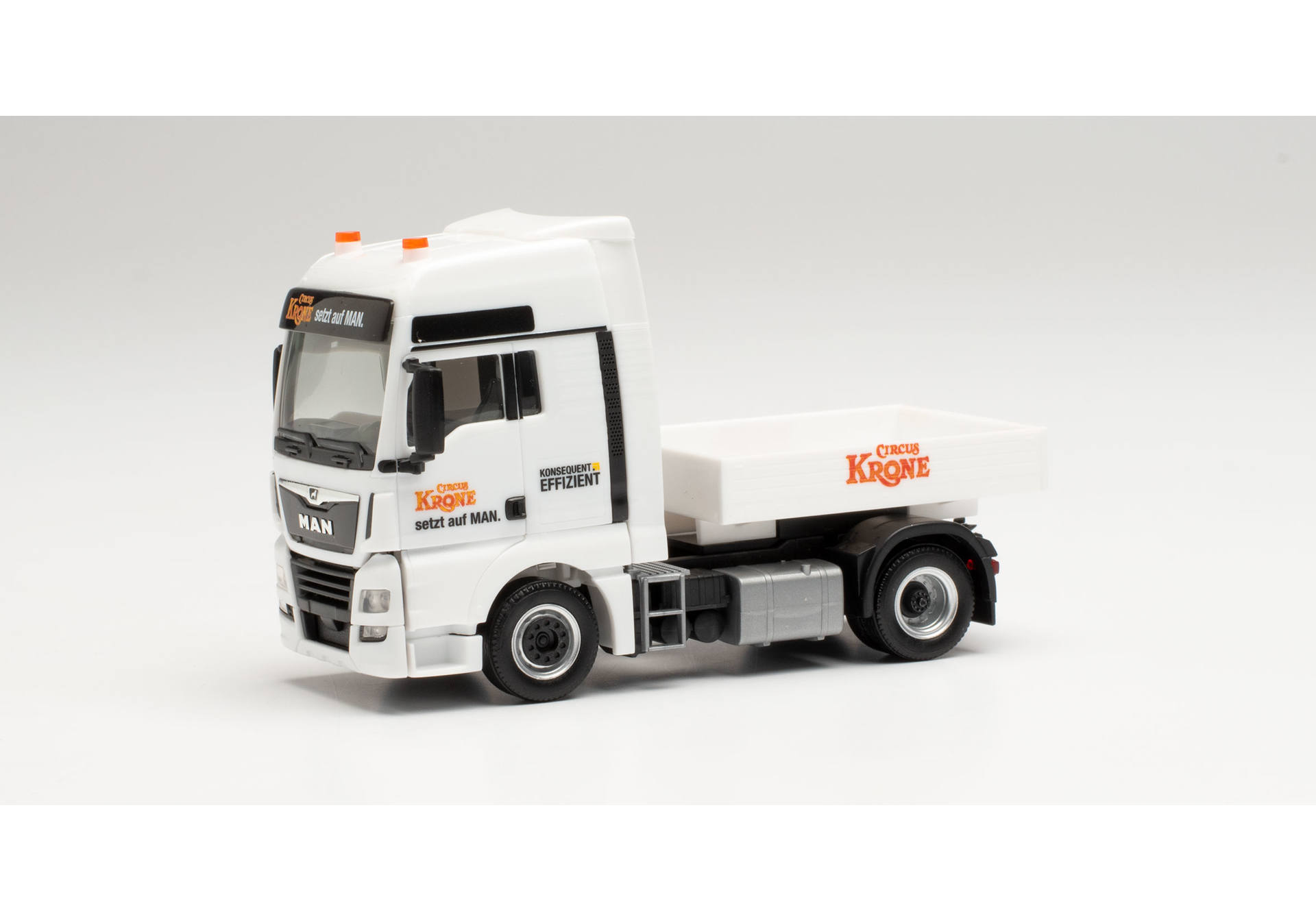 MAN TGX XXL Euro 6c tractor with ballast flatbed Circus Krone