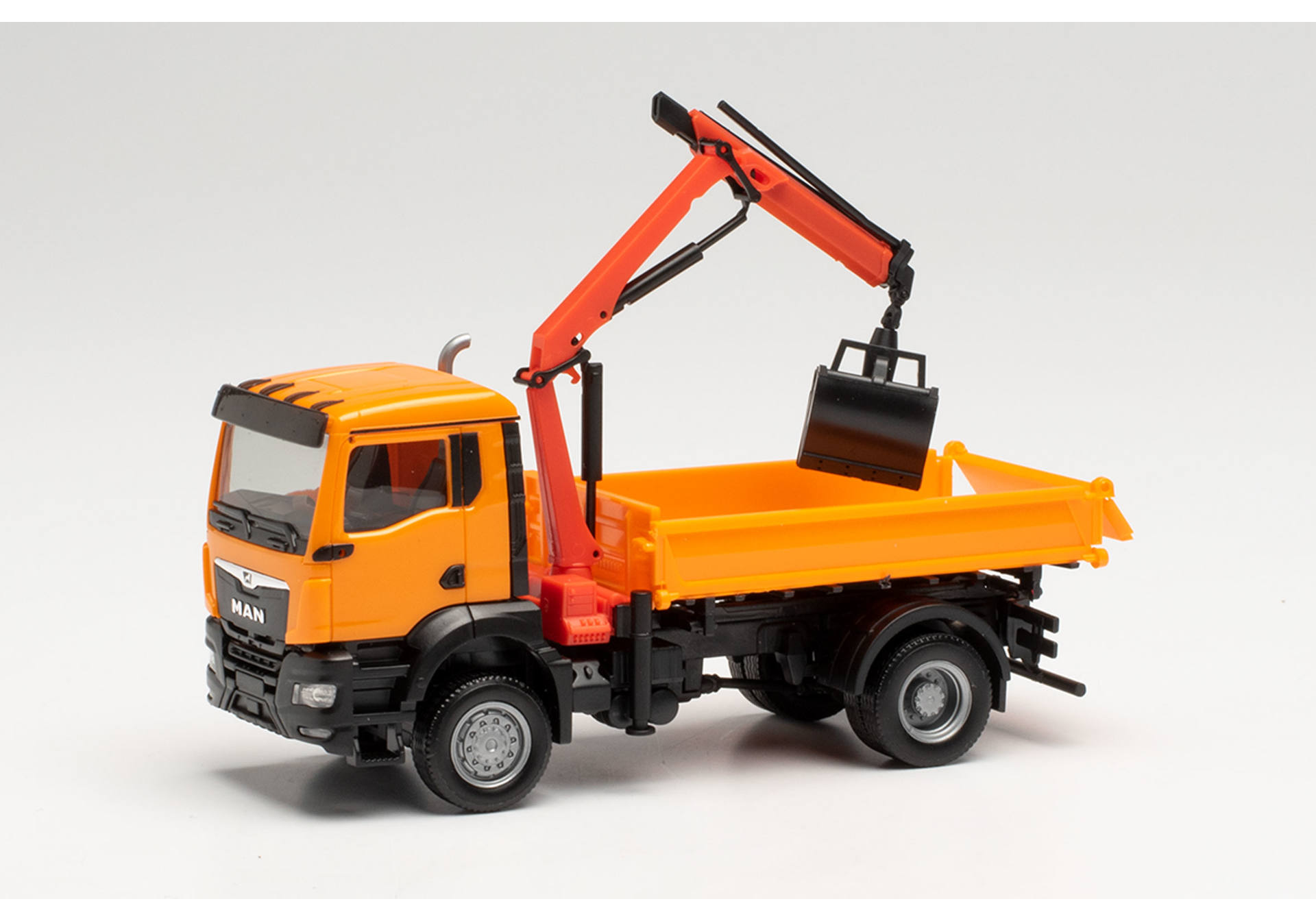 MAN TGS NN three way tipper with cramshell grab, municipal orange