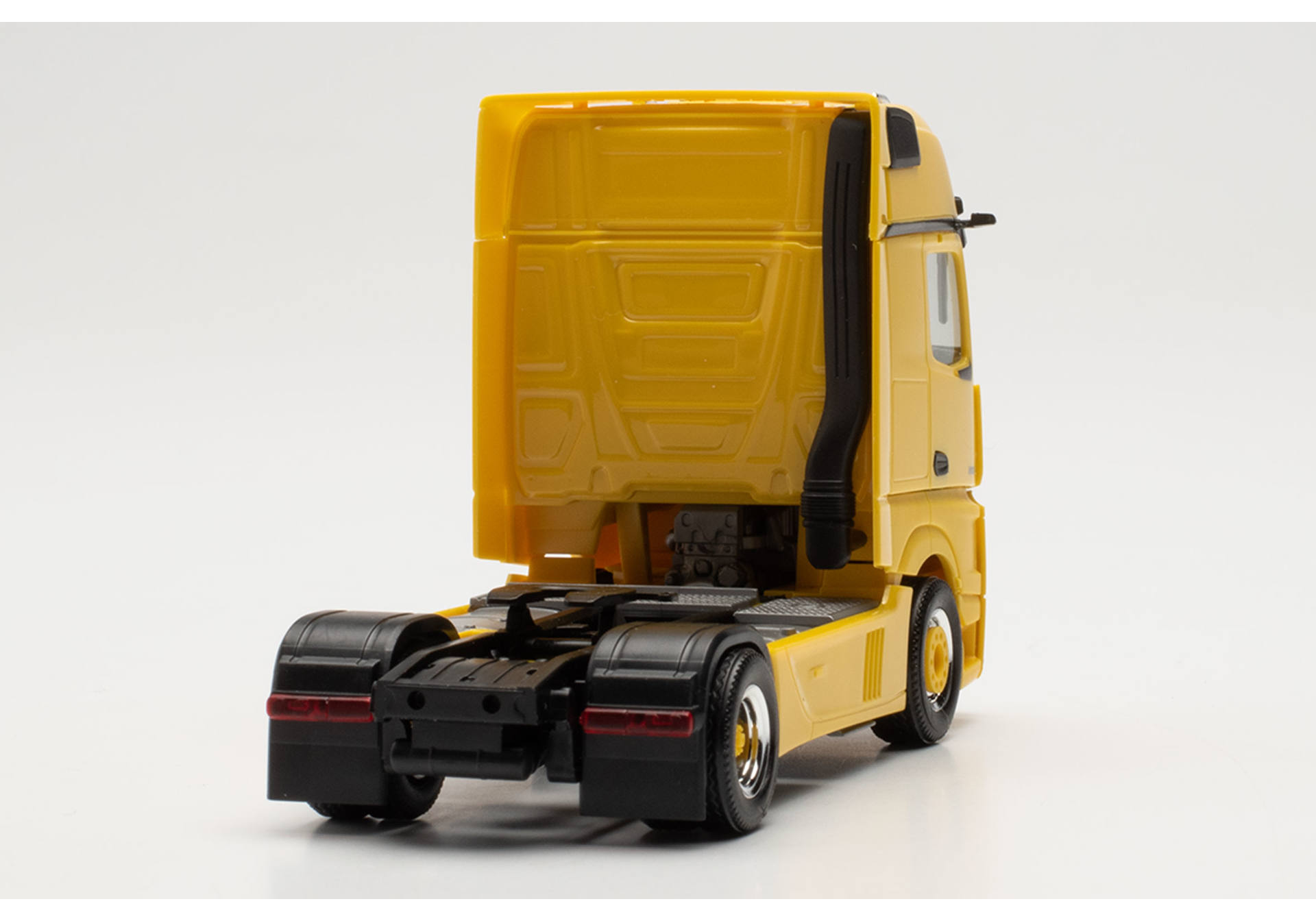 Mercedes-Benz Actros Gigaspace tractor with lamp bar and bull bar, traffic yellow