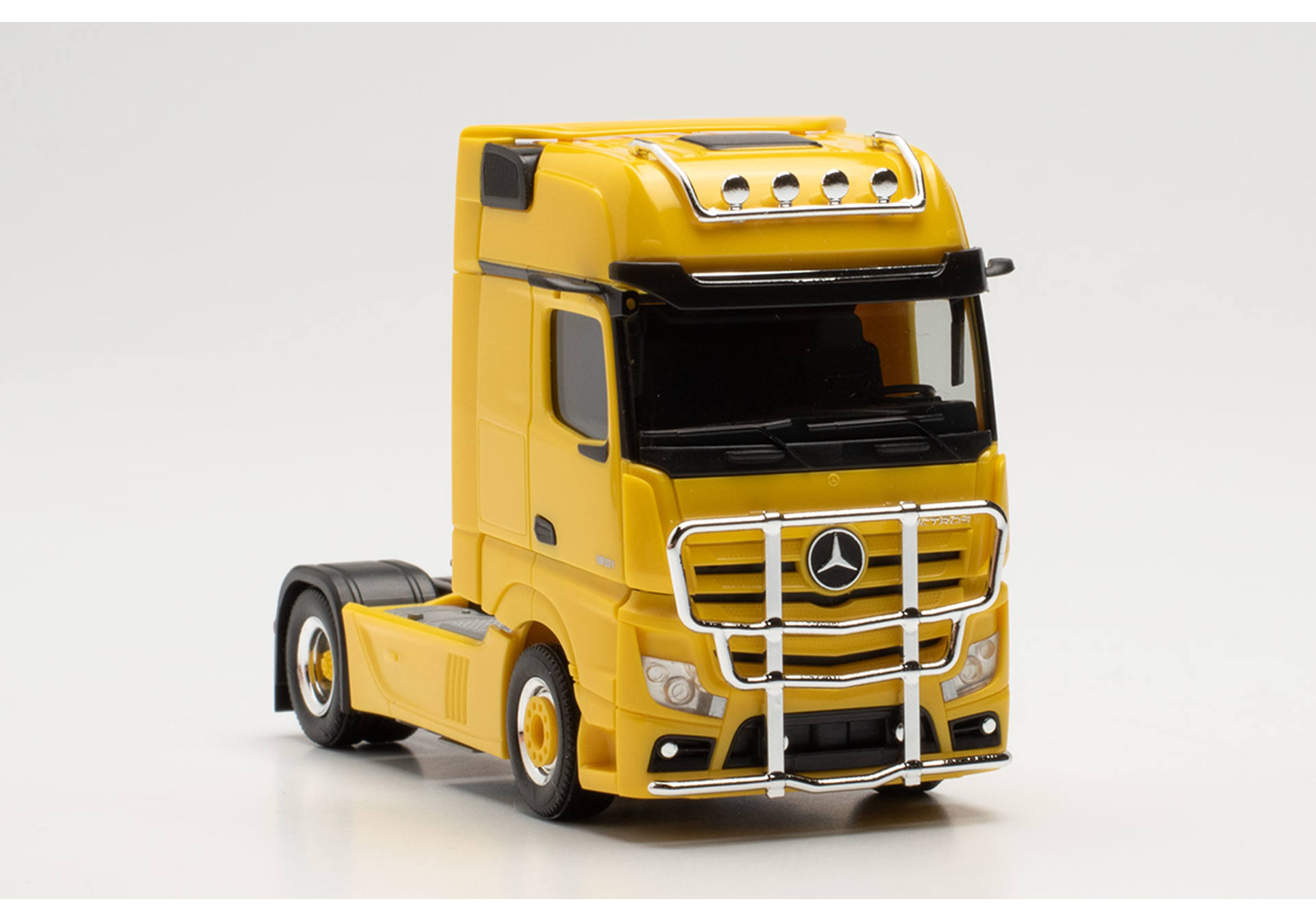 Mercedes-Benz Actros Gigaspace tractor with lamp bar and bull bar, traffic yellow