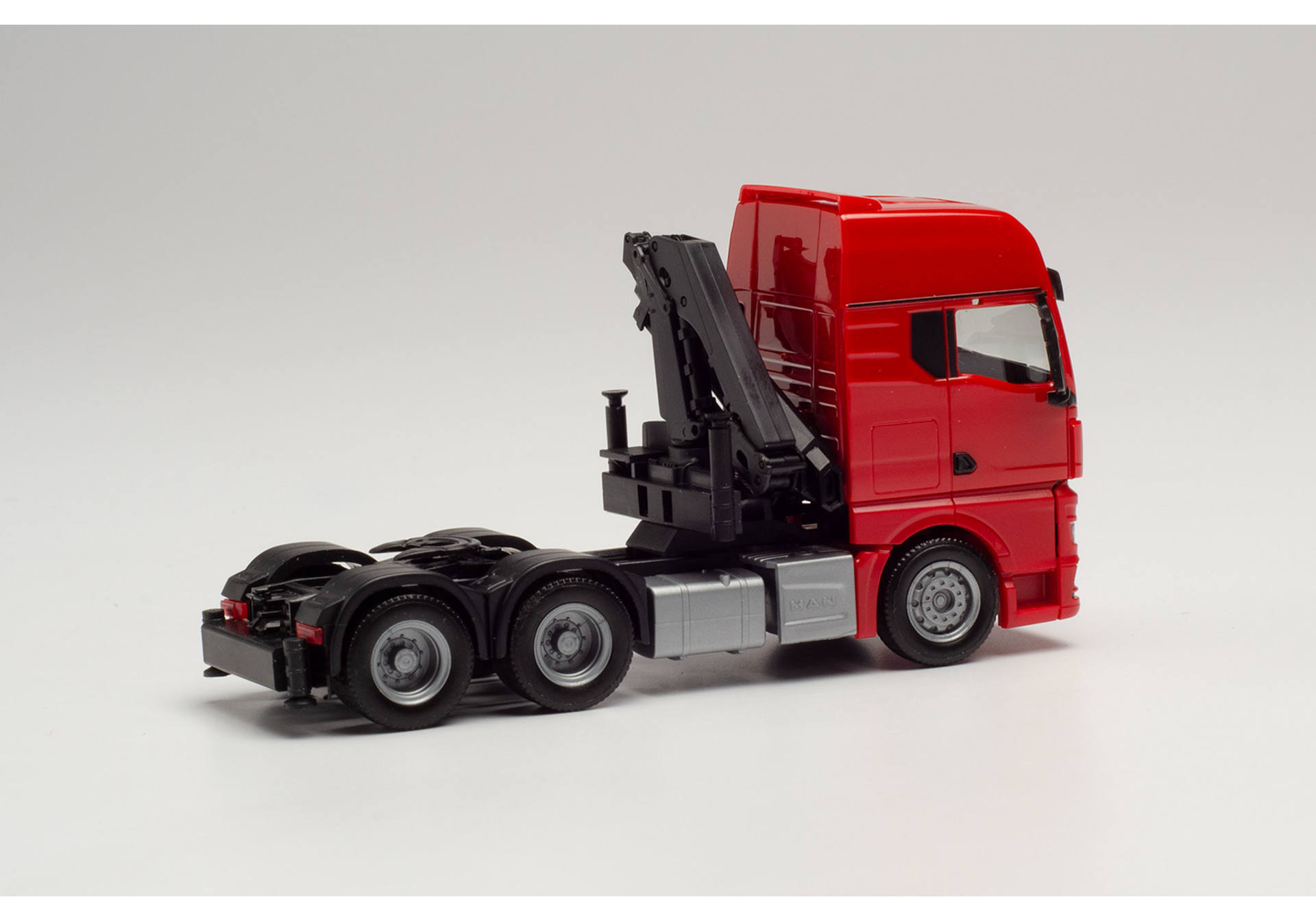 MAN TGX GX 6x4 tractor with crane, red