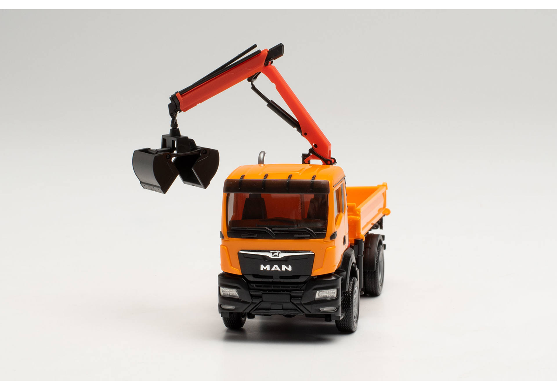 MAN TGS NN three way tipper with cramshell grab, municipal orange